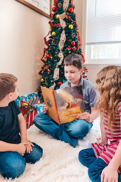 three kids reading Christian Children’s Books Under $40
